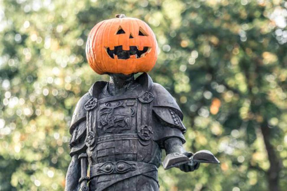 King Alfred statue with a pumpkin on his head
